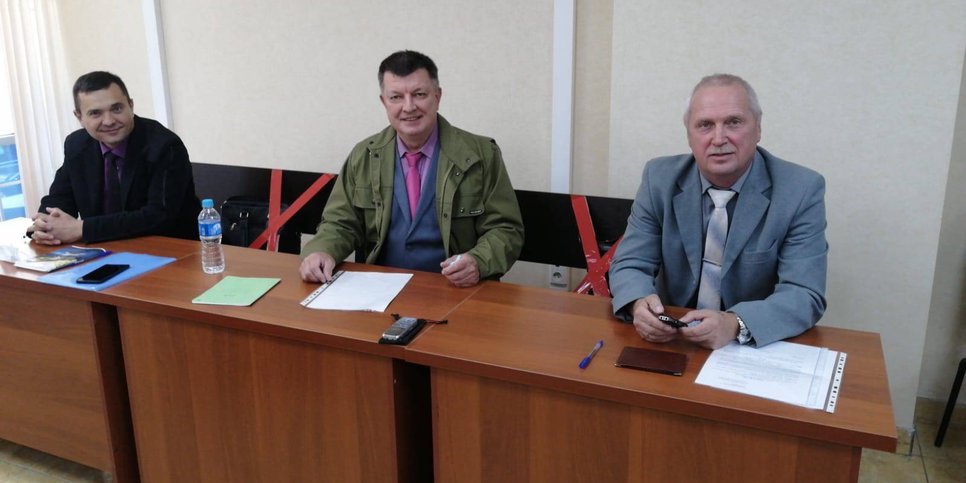 From left to right: Artur Netreba, Aleksandr Kostrov, Viktor Bachurin in court