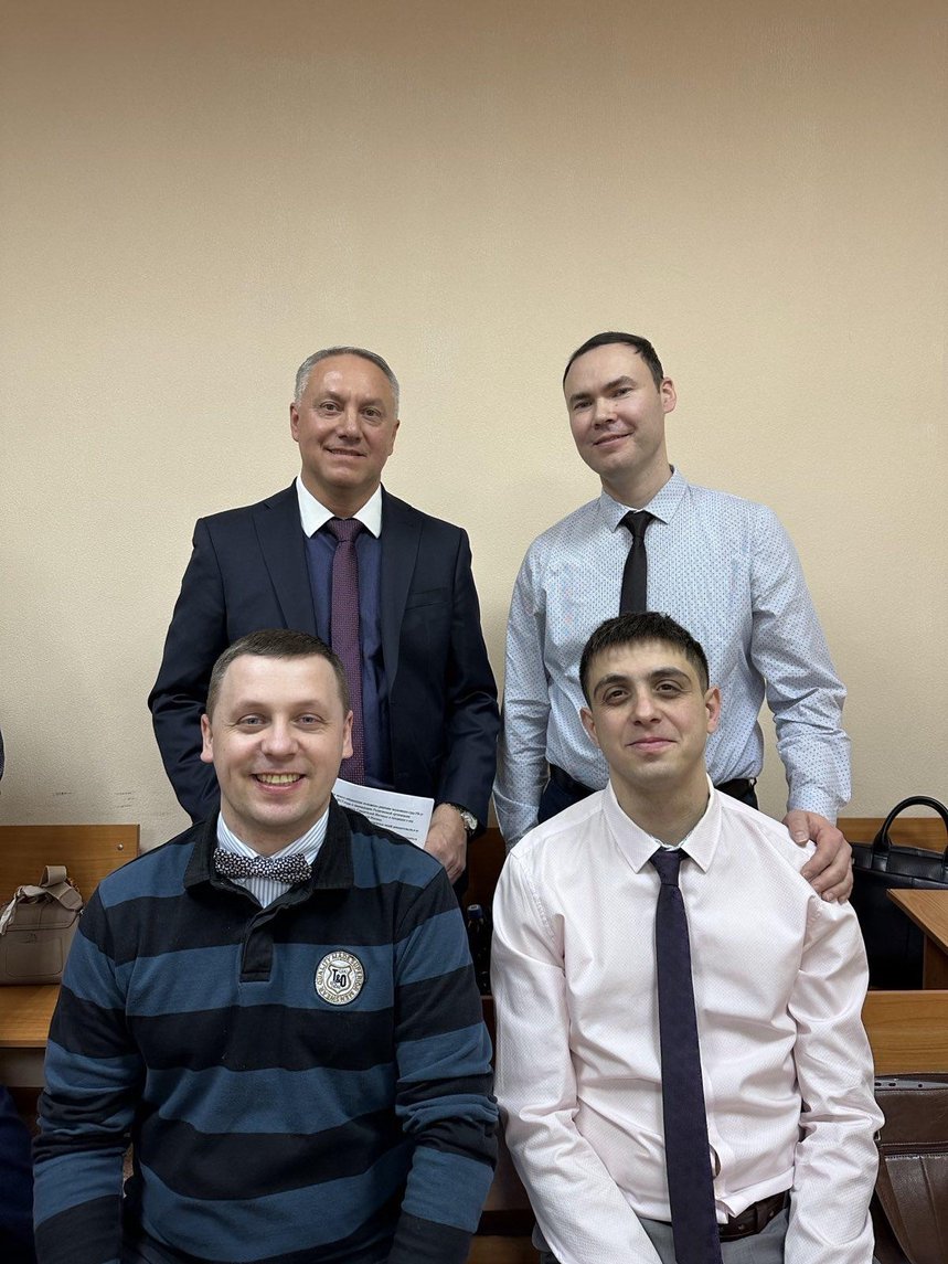 Defendants in the courtroom during a break